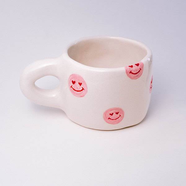 Rankų darbo keramikinis puodelis - rožiniai veidukai